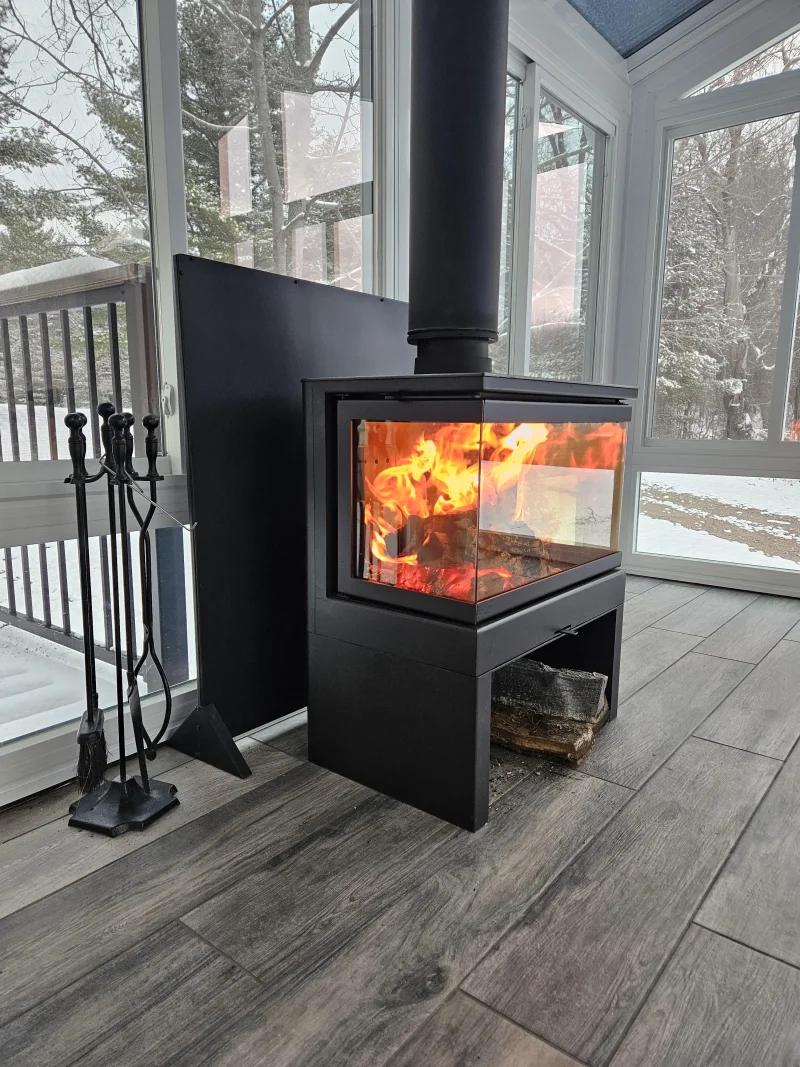 KFDarianasideshotof3sidedglassfireplace.webp